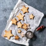 Star-shaped cookies on a piece of parchment paper.