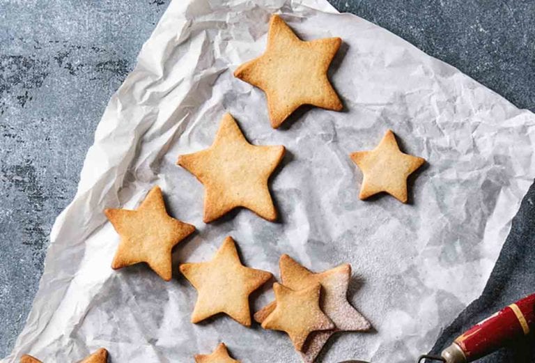 Star-shaped cookies on a piece of parchment paper