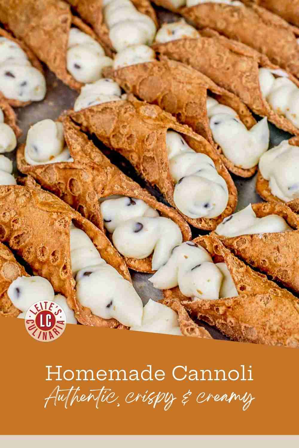 Close-up of golden, bubbly cannoli shells piped with creamy ricotta filling and mini chocolate chips.