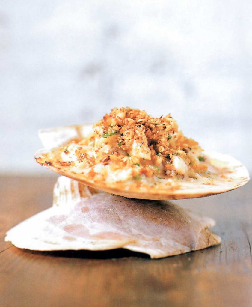 Baked seafood imperial--crab, shrimp, scallops, and calamari in a cream sauce, topped with bread crumbs and baked--on a water cracker