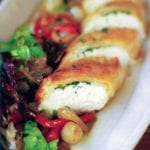 Goat cheese and herbs wrapped in a phyllo pastry log along side a red pepper salad