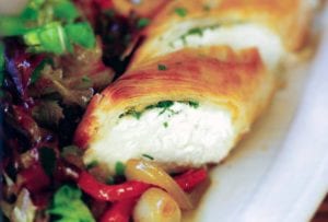 Goat cheese and herbs wrapped in a phyllo pastry log along side a red pepper salad
