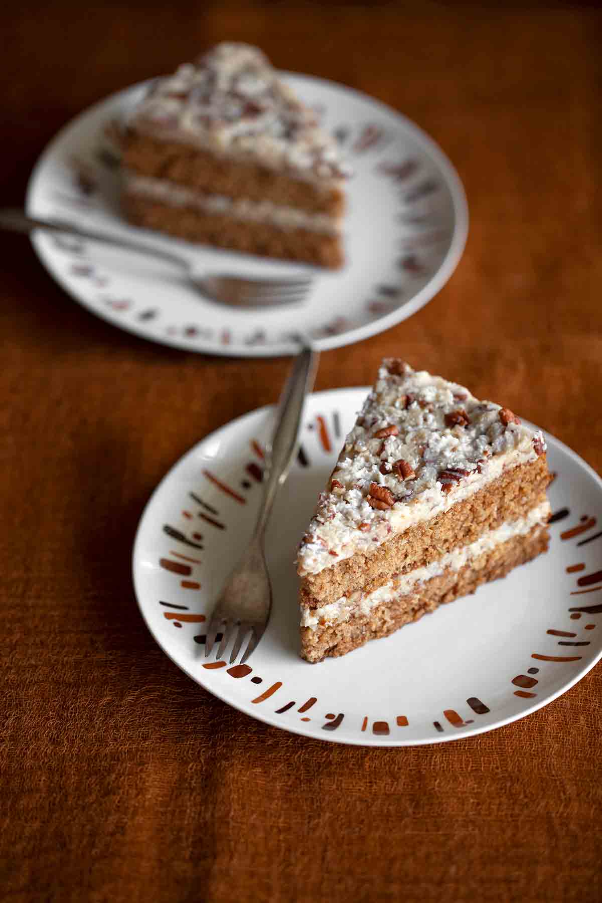 Two slices of oatmeal cake on plates