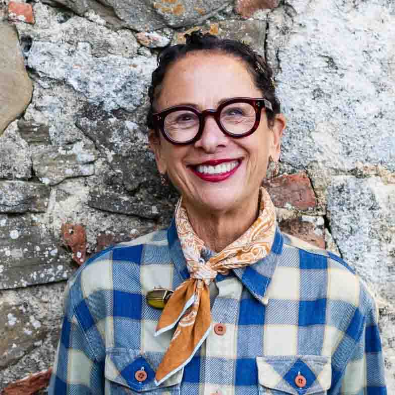 Chef Nancy Silverton standing in front of a wall.