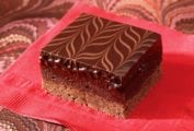 A raspberry-truffle brownie bar--layers of cocoa shortbread, raspberry brownie, and chocolate ganache swirled on top