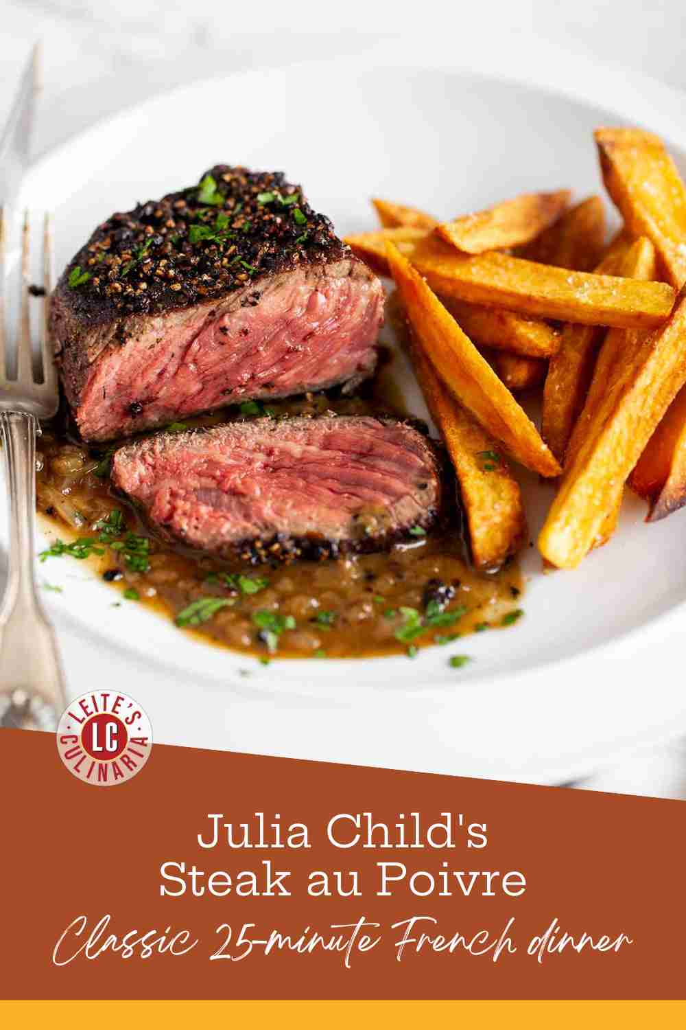 liced medium-rare peppercorn-crusted steak drizzled with brown pan sauce next to golden french fries.