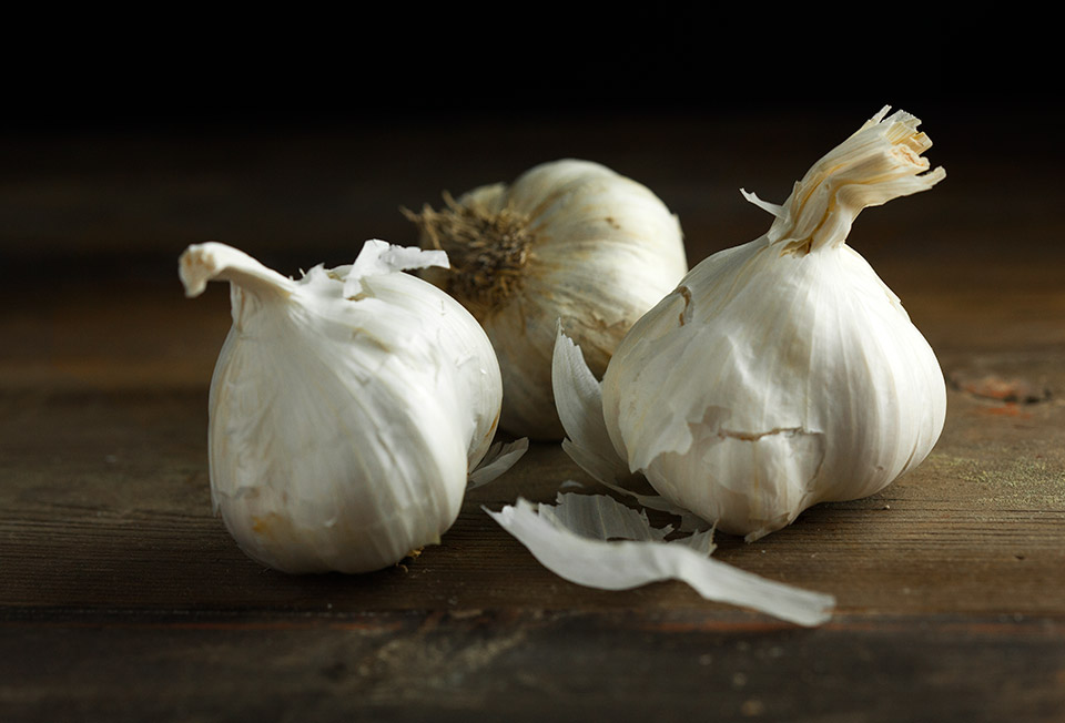 Close up of three cloves of garlic
