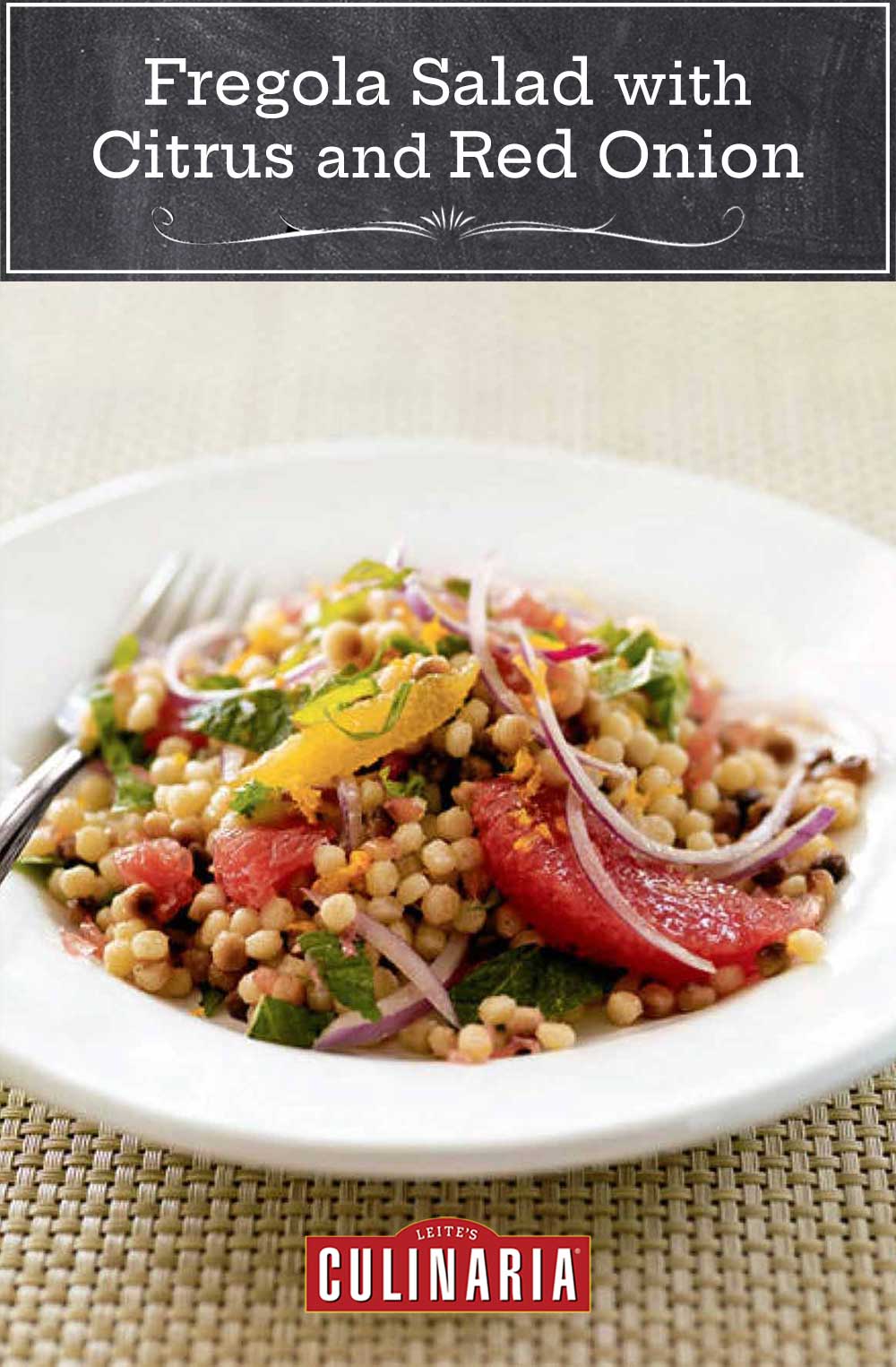 A white bowl filled with fregola salad with fresh citrus and red onion and mint leaves on a woven placemat.