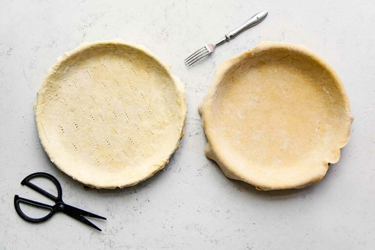 Two vinegar pie crusts in pie pans.