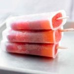 Three striped juice pops stacked on top of each other.