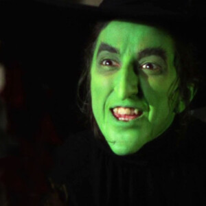 A witch with a green face.