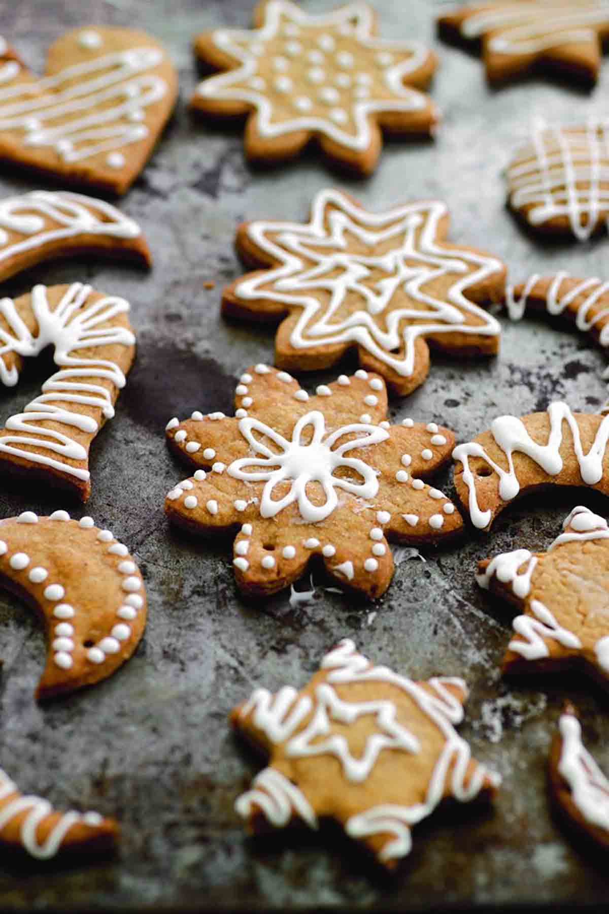 Sugar Christmas snow cookies, in various shapes, decorated with white icing.