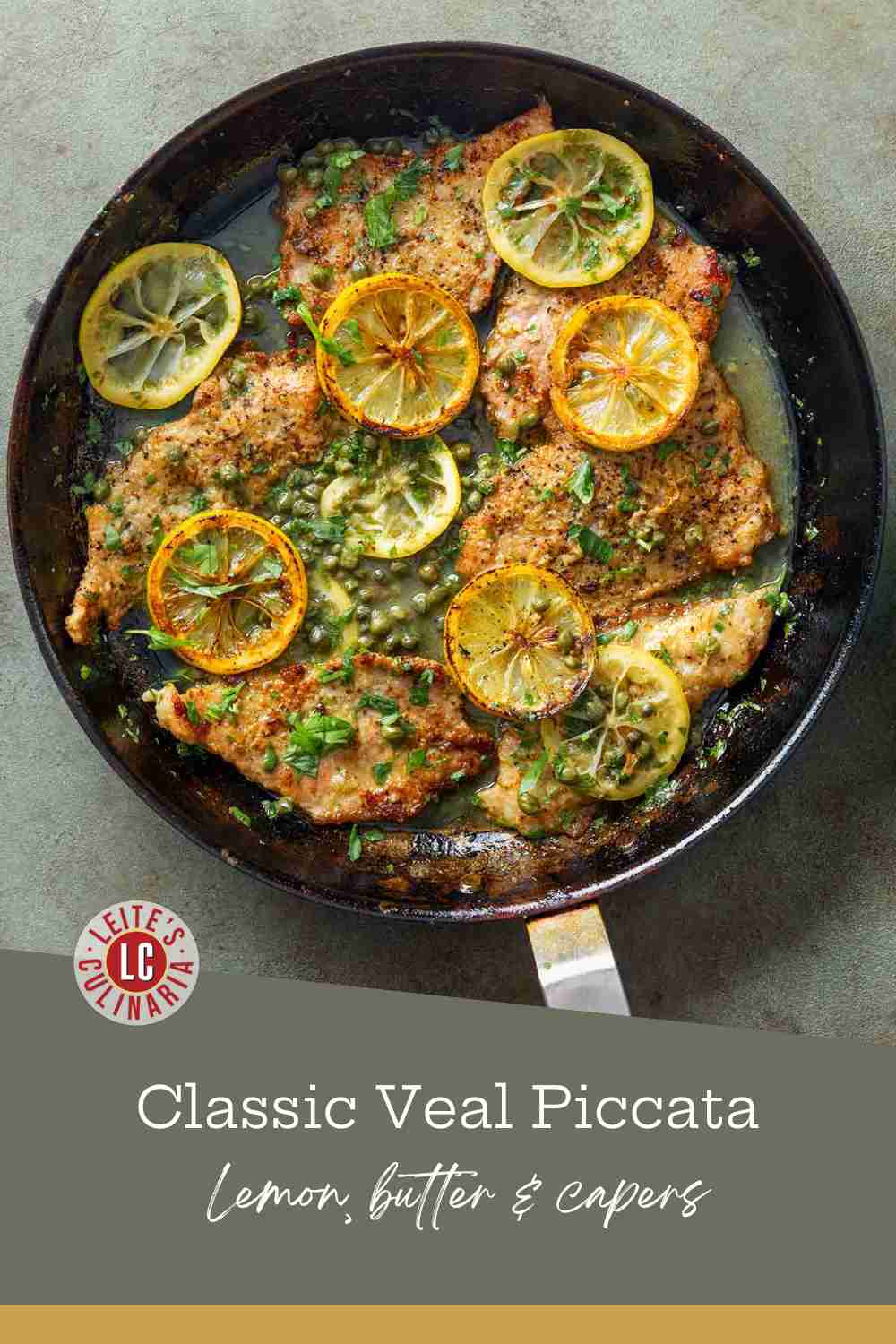 Golden veal cutlets simmering in a dark skillet with lemon slices and capers in a buttery white wine sauce.