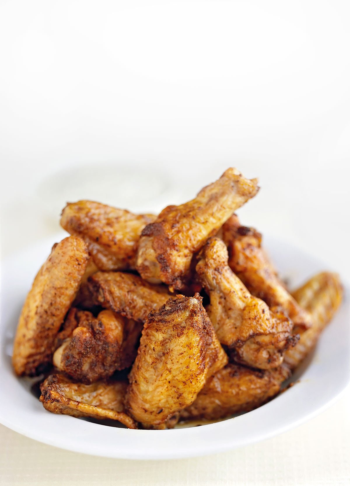 A bowl of five spice chicken wings.