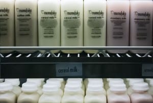 Cereal milk bottles line up in a cooler