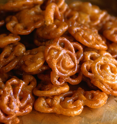 Indian Fried Dough Jalebi stacked on a table.