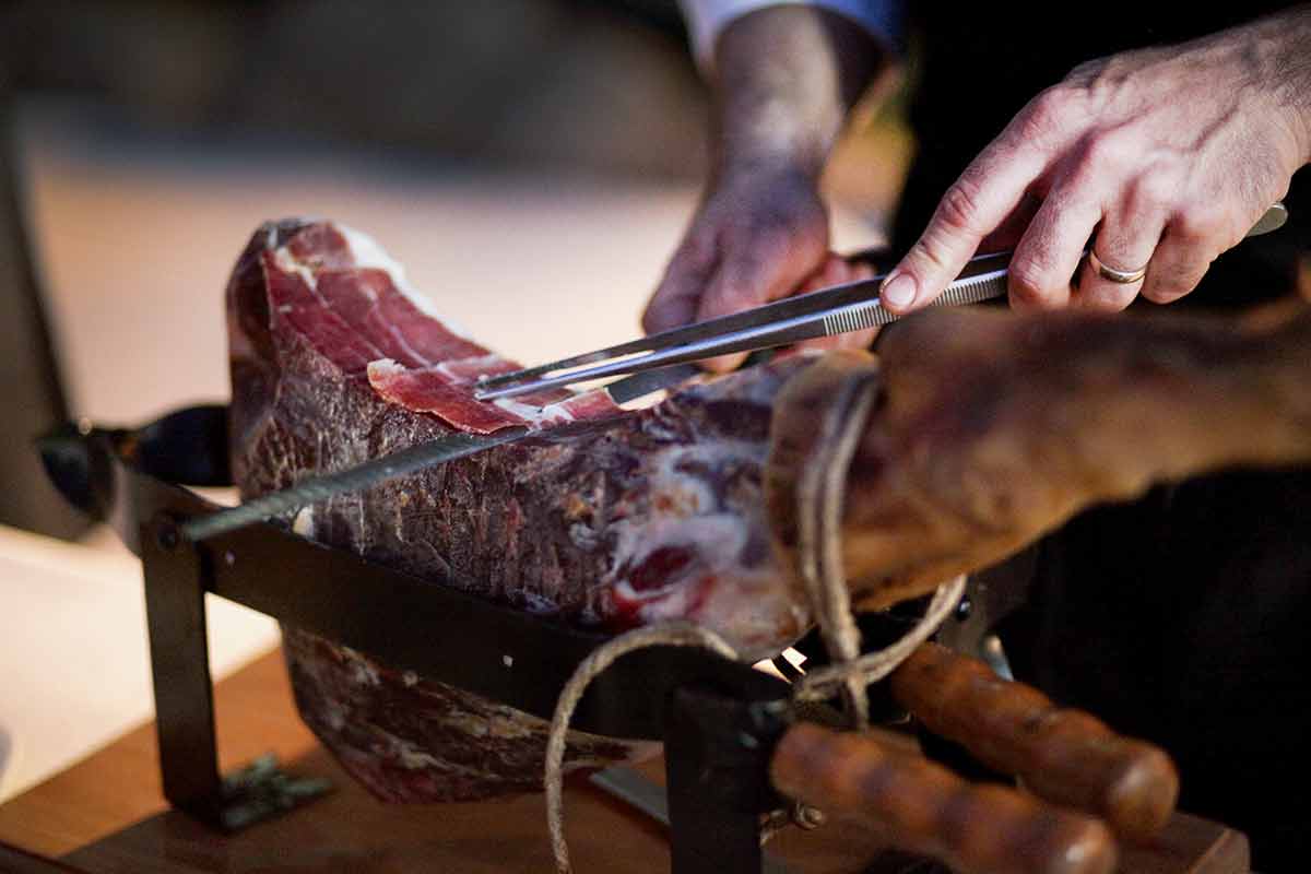 Prosciutto di Parma being carved.