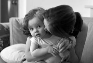 A black and white picture of a mom with her daughter