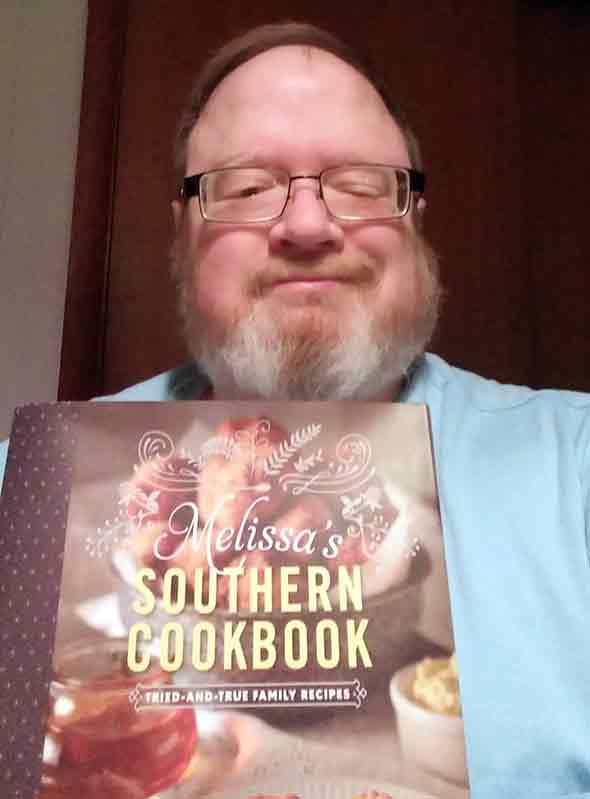 A very happy LC giveaway winner with Melissa's Southern Cookbook in hand.