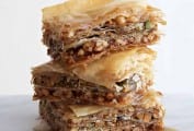 Three pieces of vegan baklava stacked on top of each other.