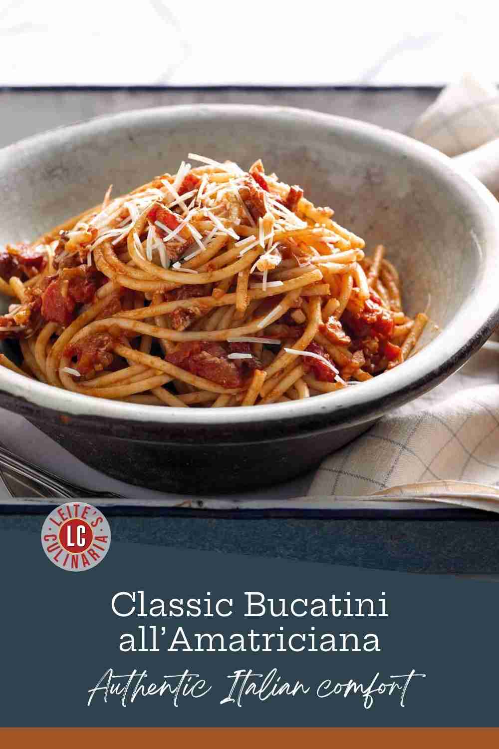 Twirls of thick bucatini pasta coated in a rich, red tomato and guanciale sauce, topped with freshly grated pecorino Romano.