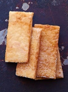 Four phyllo crisps lined up on a plate