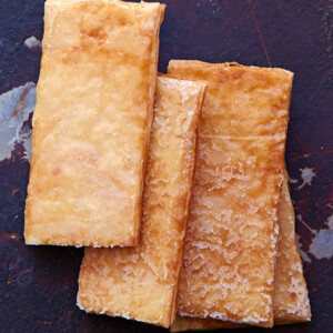 Four phyllo crisps lined up on a plate