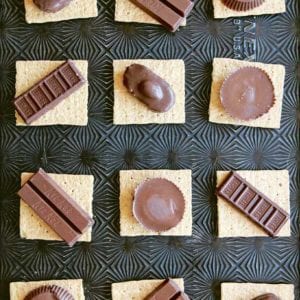 12 graham crackers topped with snack size candy bars to make candy bar s'mores.