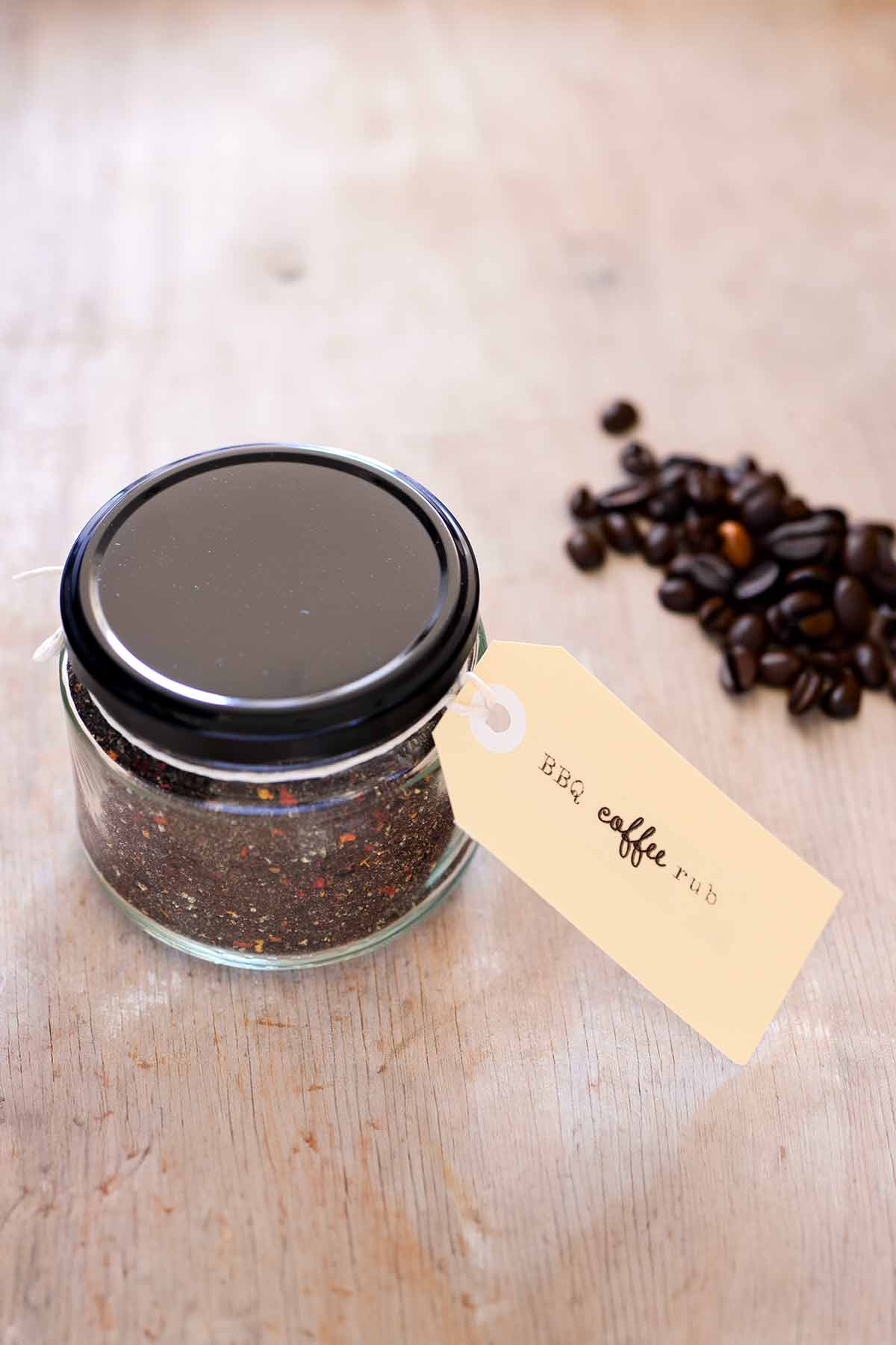 A jar of coffee rub with a manila gift tag.