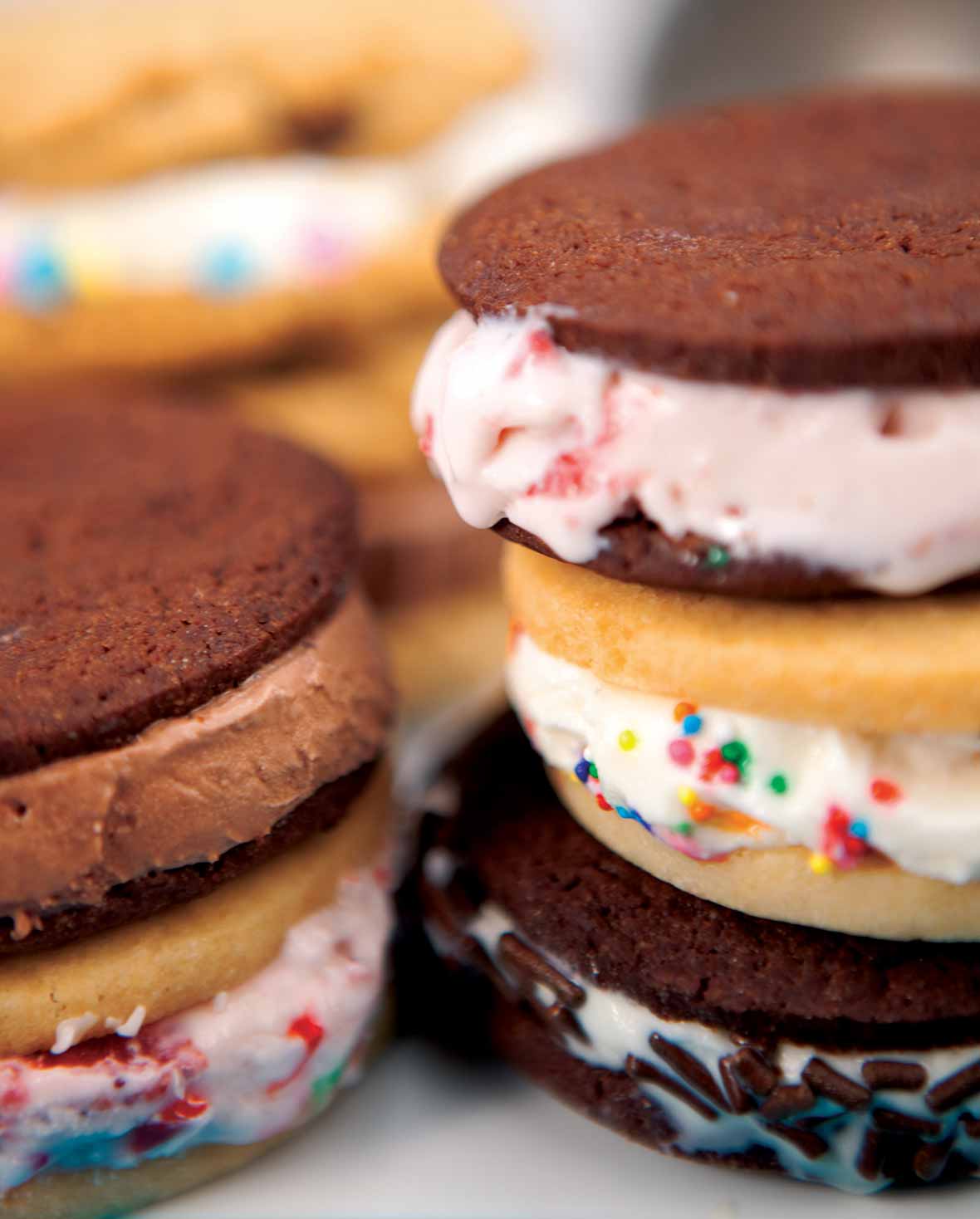Several ice cream cookie sandwiches stacked on top of each other.