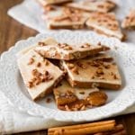 Plate of pumpkin spice toffee--made with toffee, pumpkin spice, white chocolate, and pecans