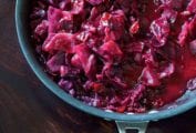 A Calphalon skillet filled with braised red cabbage with cranberries.