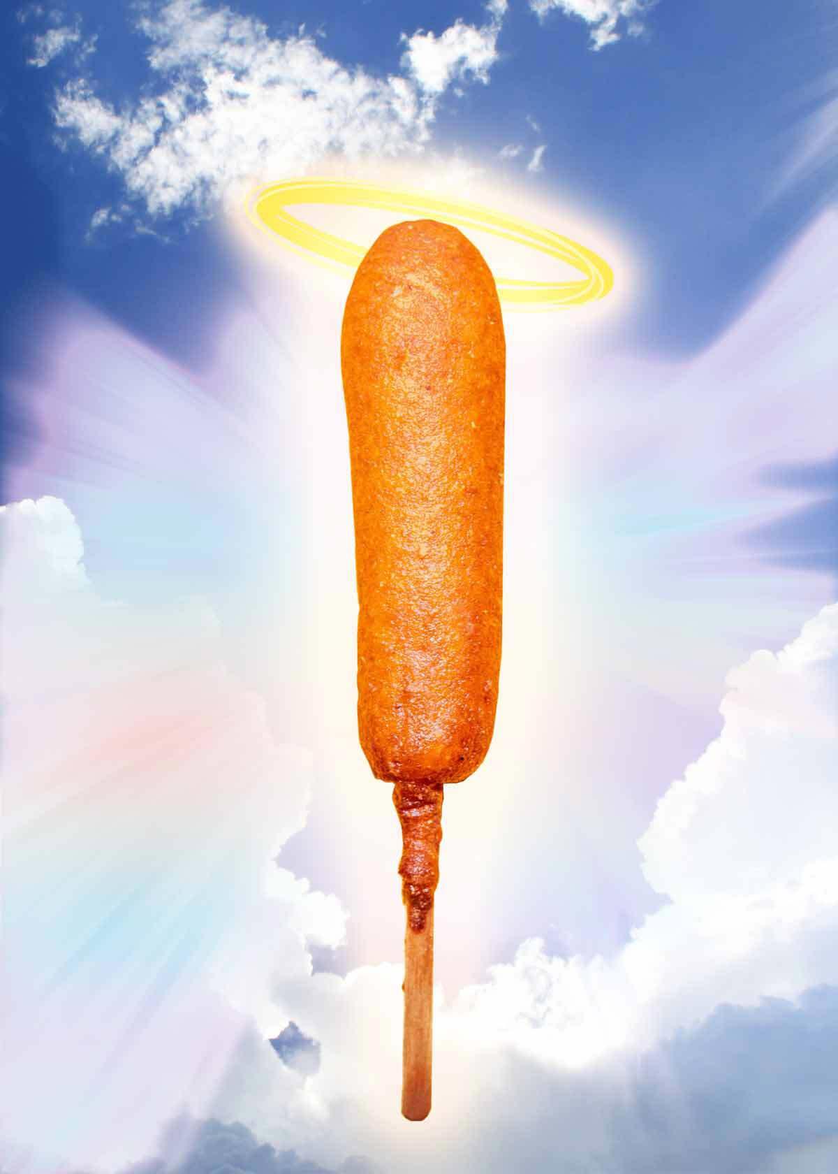 a corndog with a halo on a heavenly sky