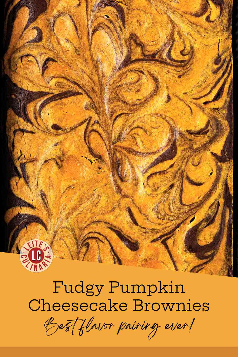 An overhead view of freshly baked pumpkin swirl brownies in the pan.