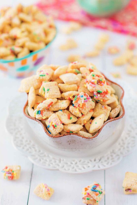 Two bowls of chex mix coated in funfetti