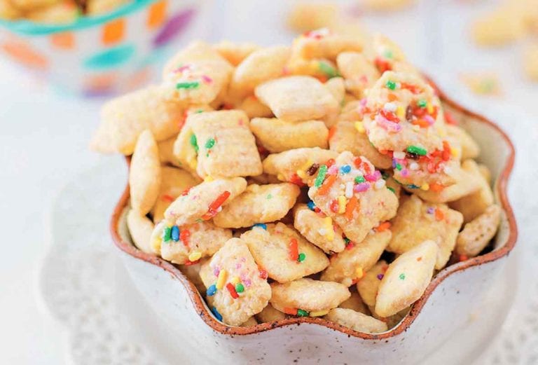Two bowls of chex mix coated in funfetti