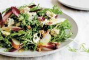 Plate of an endive, blue cheese, and pear salad with walnuts