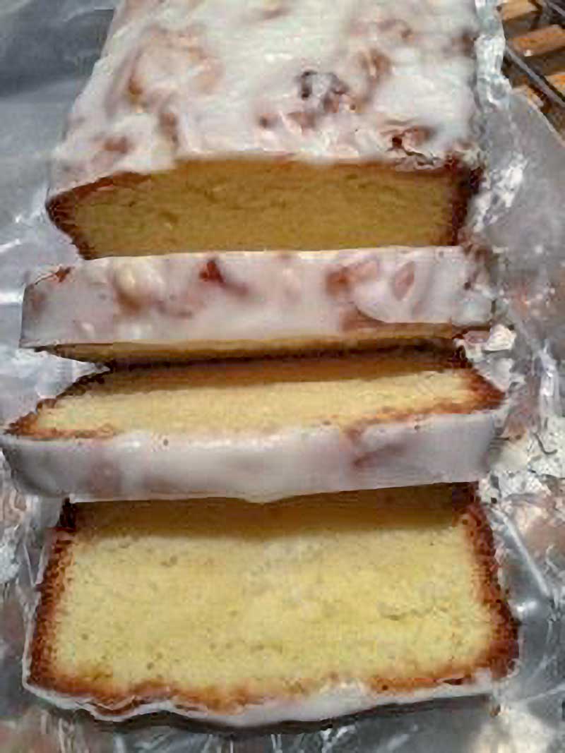 A vanilla pound cake with a lemon glaze cut into 8 slices