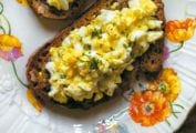 An open face egg salad sandwich on toasted whole wheat