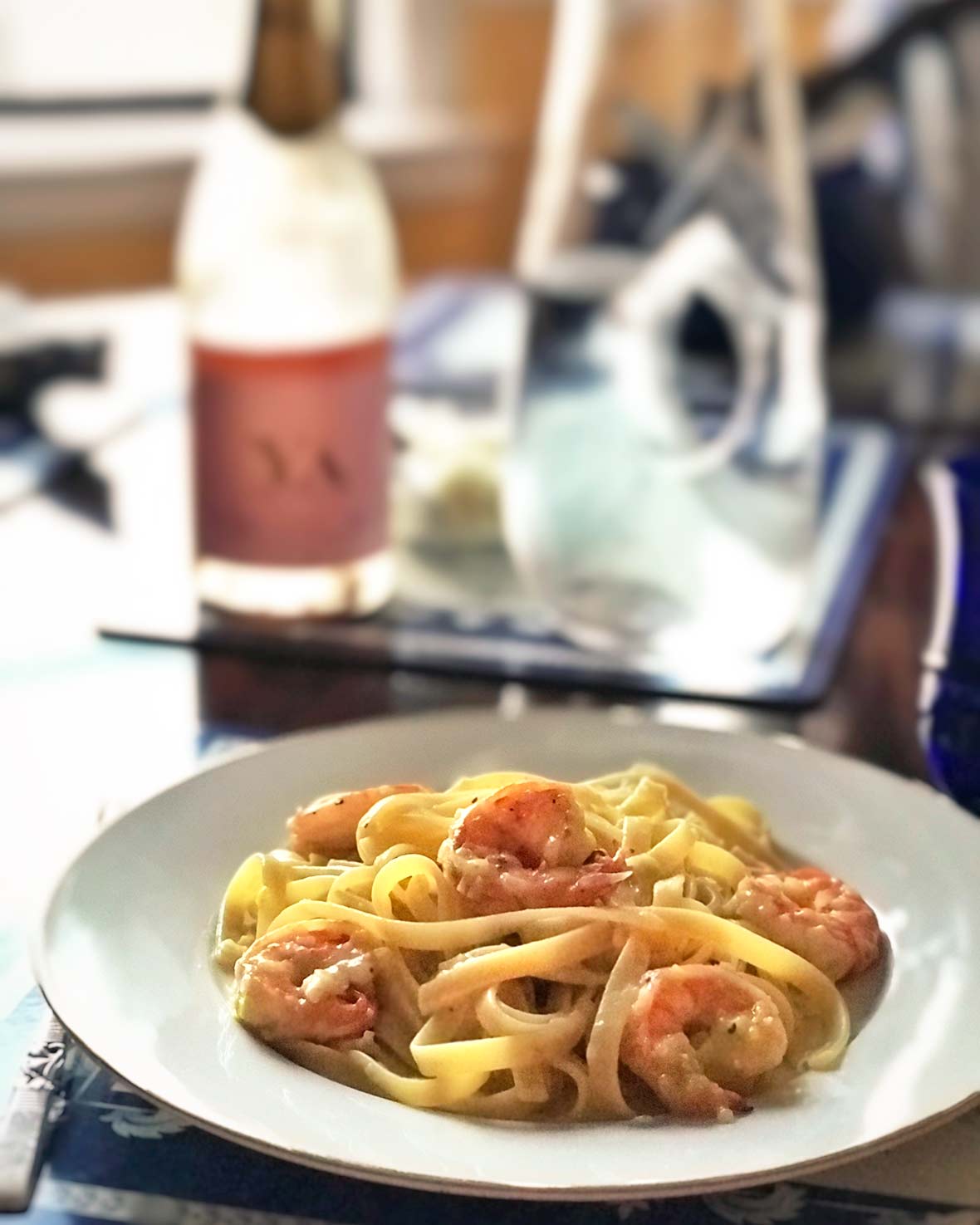 Plate with shrimp and leek pasta.