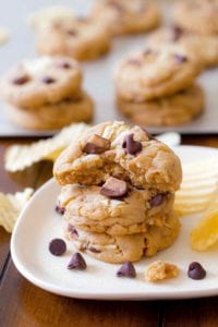 A plate of chocolate chip cookies with with potato chips and toffee pieces baked in