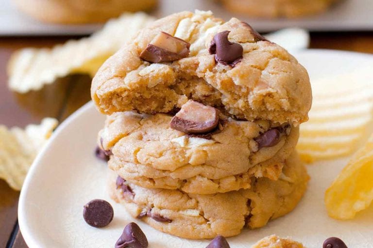 A plate of chocolate chip cookies with with potato chips and toffee pieces baked in