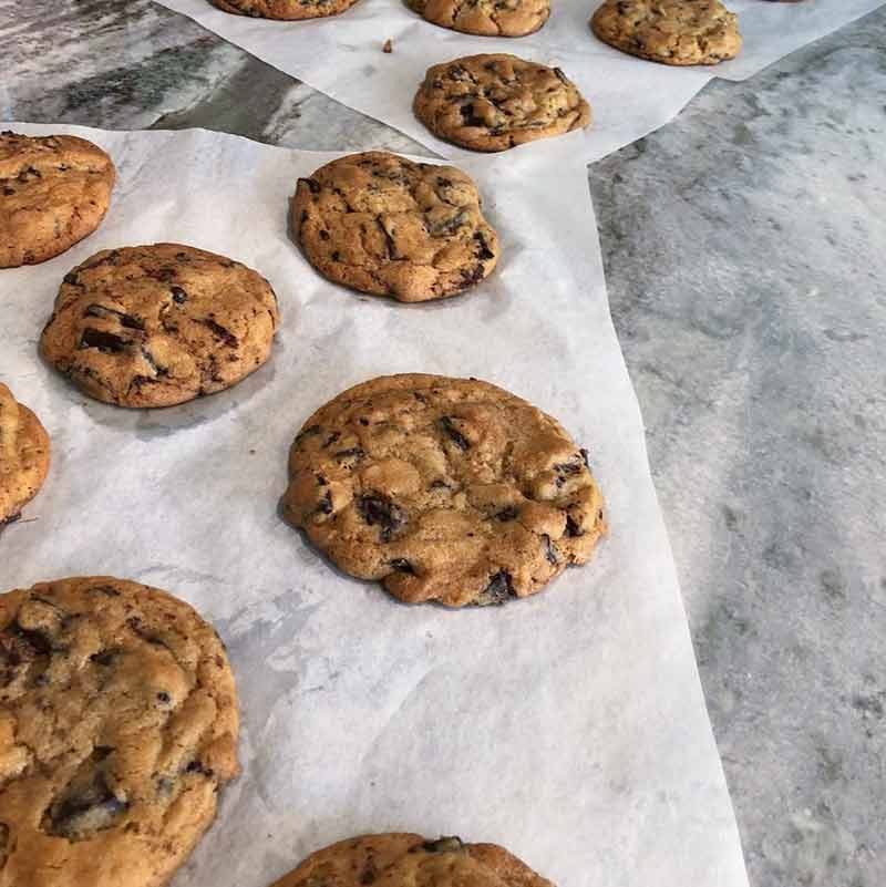 Parchment sheets with a dozen of David Leite's chocolate chip cookies that were featured in the NY Times