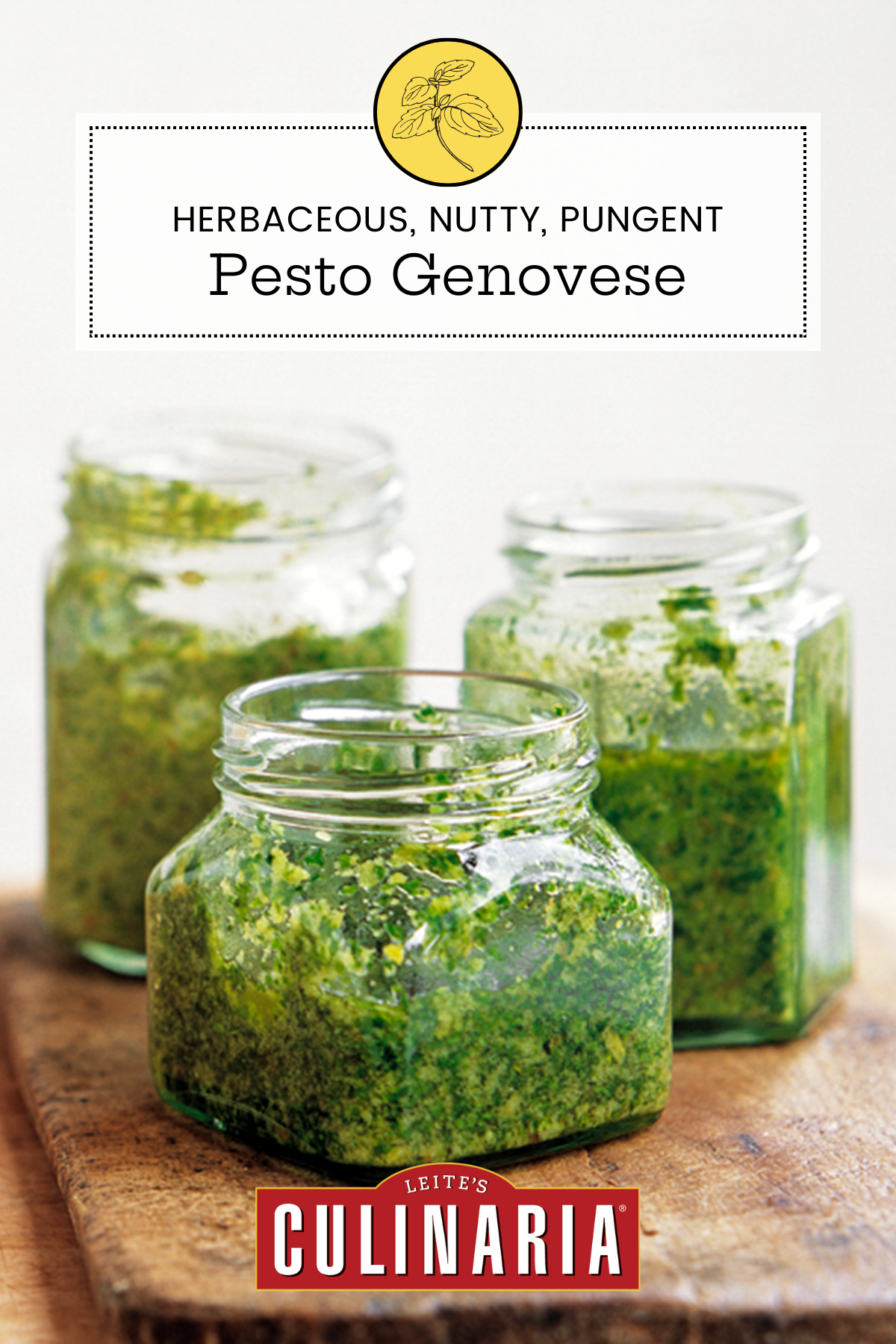Three glass jars partially filled with pesto Genovese.