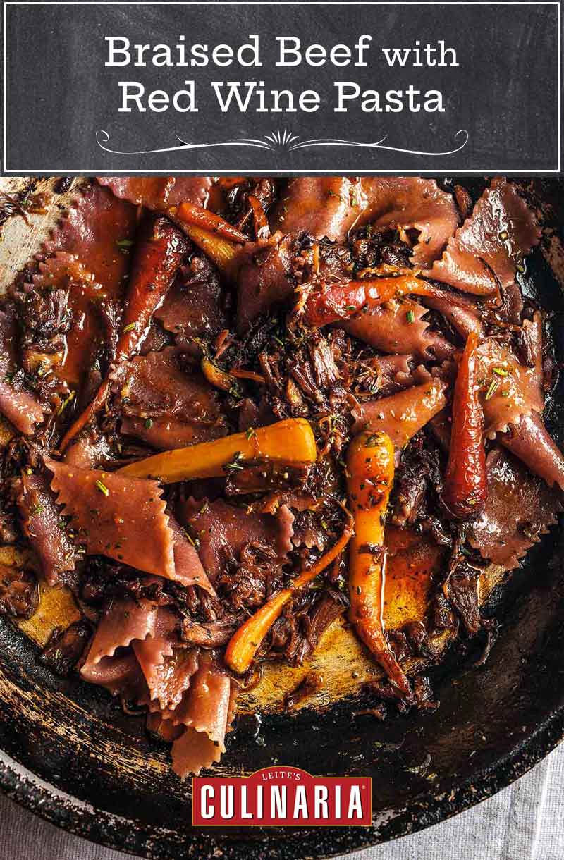 Skillet with shredded braised beef with red wine pasta and carrots