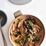 A crock filled with shiitake barley soup--mushroom, leeks, miso, ginger, scallions, nori seaweed.