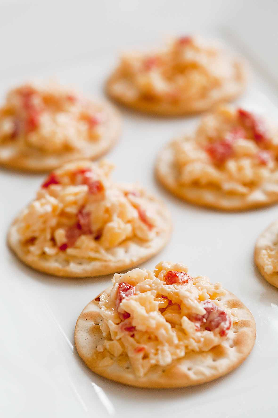 Six crackers topped with pimento cheese.