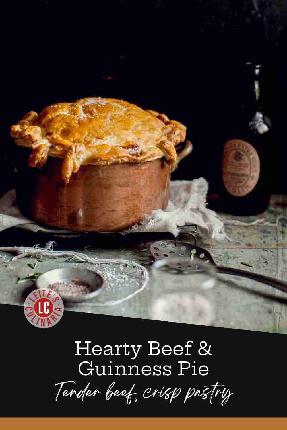 golden-brown puff pastry crust domes over a copper pot of rich beef stew with herbs and sea salt.
