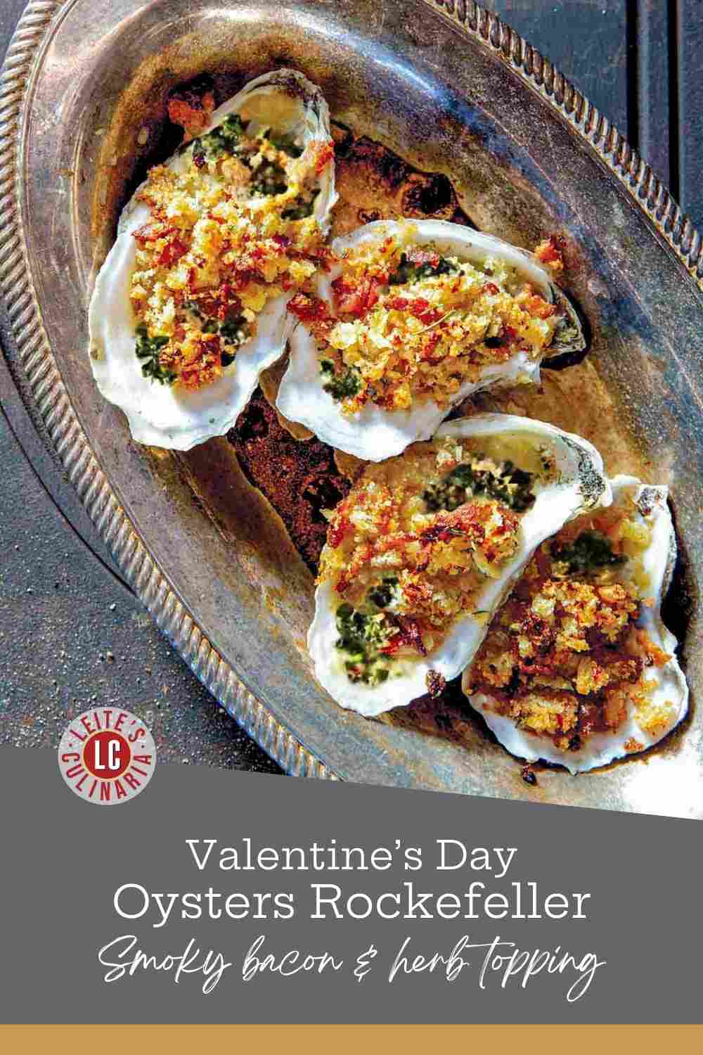 Four baked oysters in shells topped with golden bacon bread crumbs on a vintage silver platter.