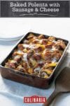 A rectangular casserole dish filled with baked polenta with sausage and cheese.